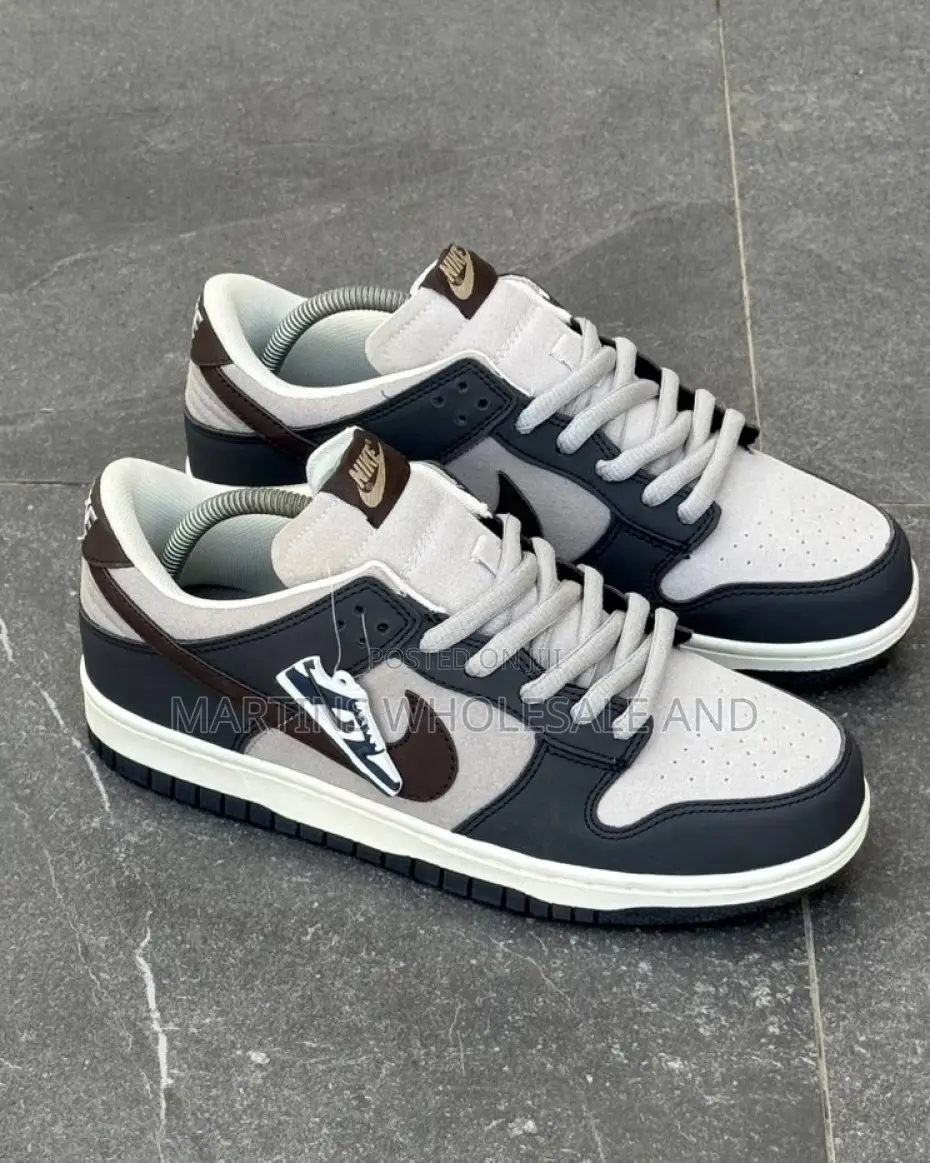 A Pair of Low-Top Nike SB Dunk Low "Otomo Katsuhiro" Sneakers Featurin