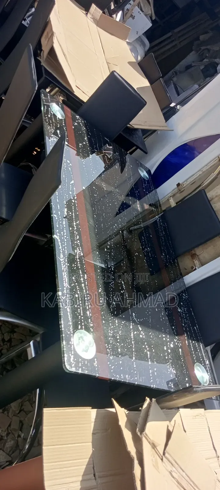 A 6 Chair Dining Table With Glass Top