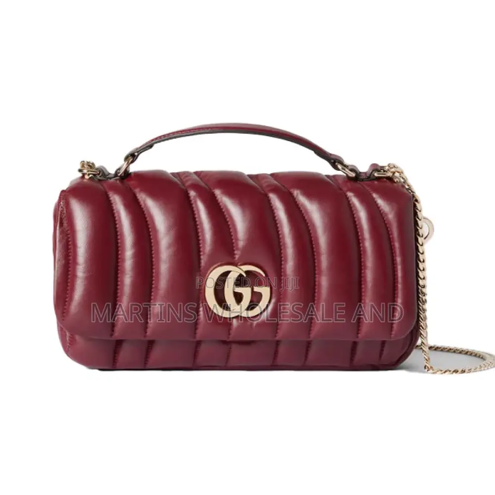 Reproductions of the Gucci GG Milano Mini Top Handle Bag.