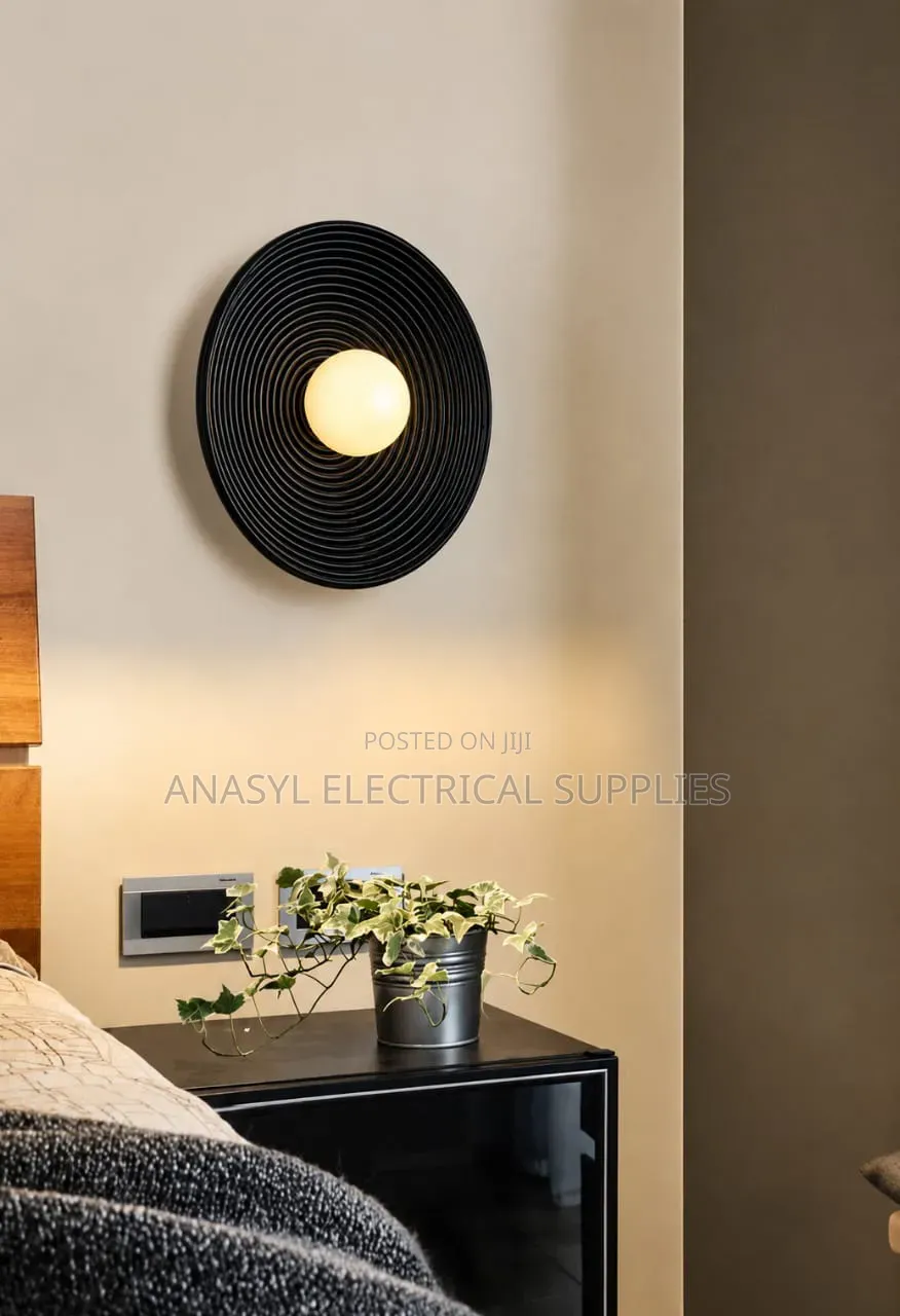 A Modern Black or Gold Circular Swirl LED Wall Lamp