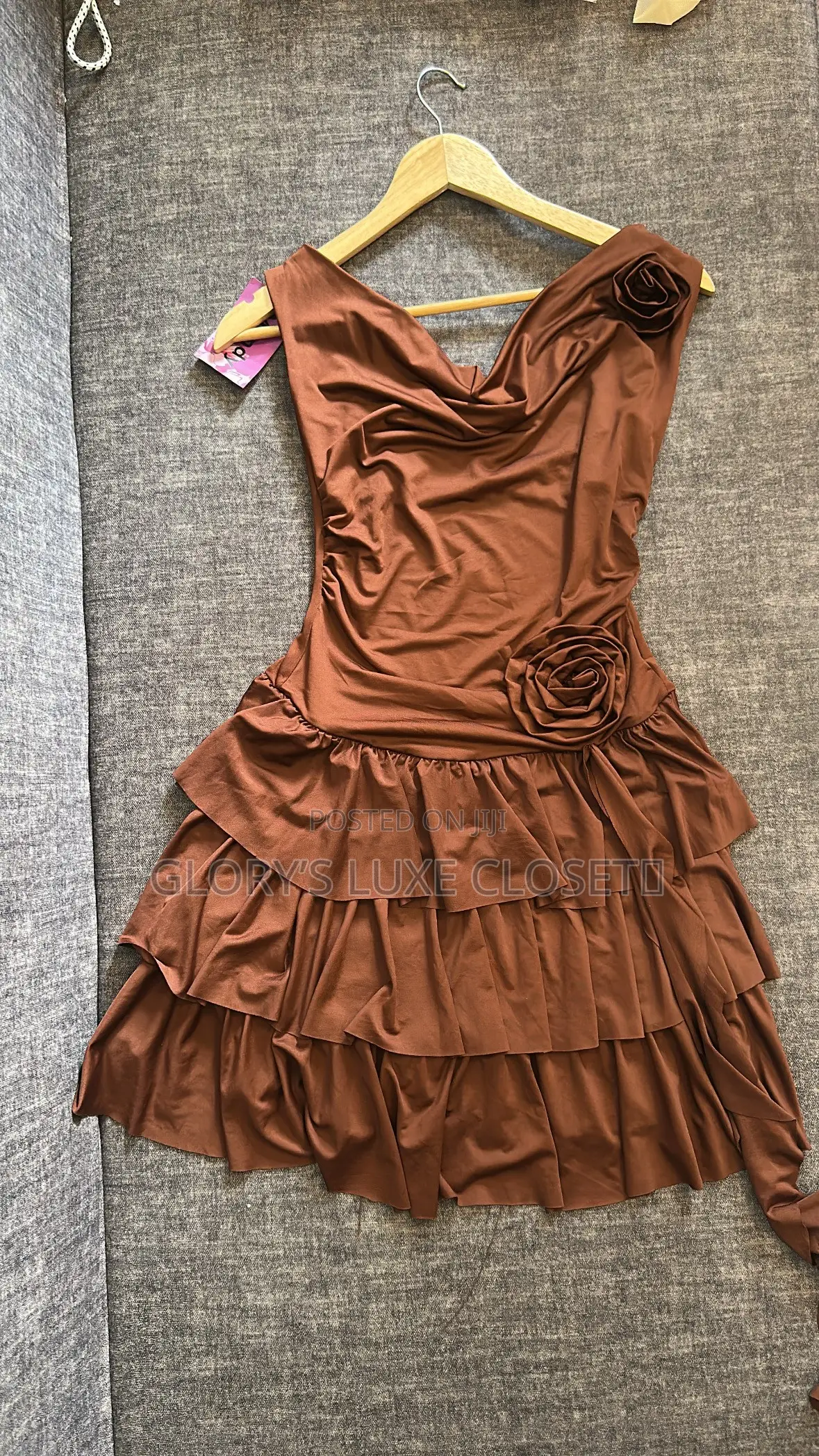 Rosette Cowl-Neck Tiered Mini Dress.”