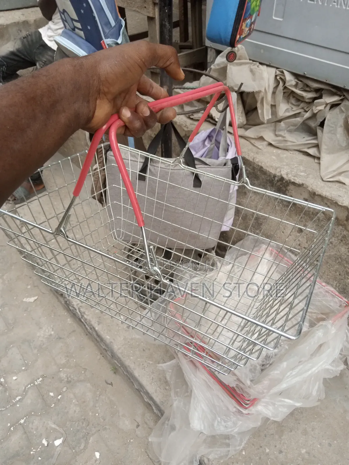 Hand Holding Grocery Basket