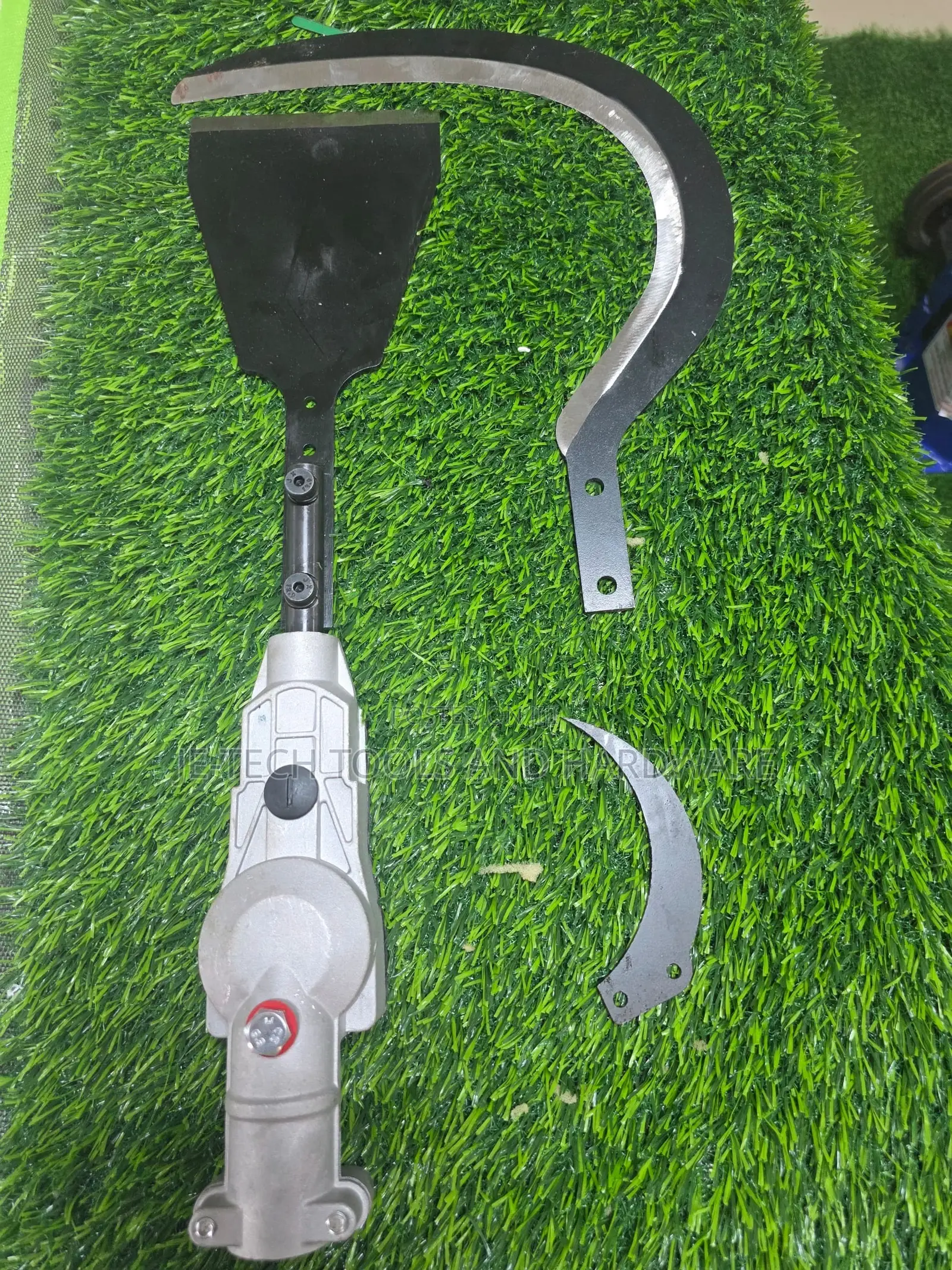 Palm Harvester Attachment Head With Interchangeable Cutting Blades
