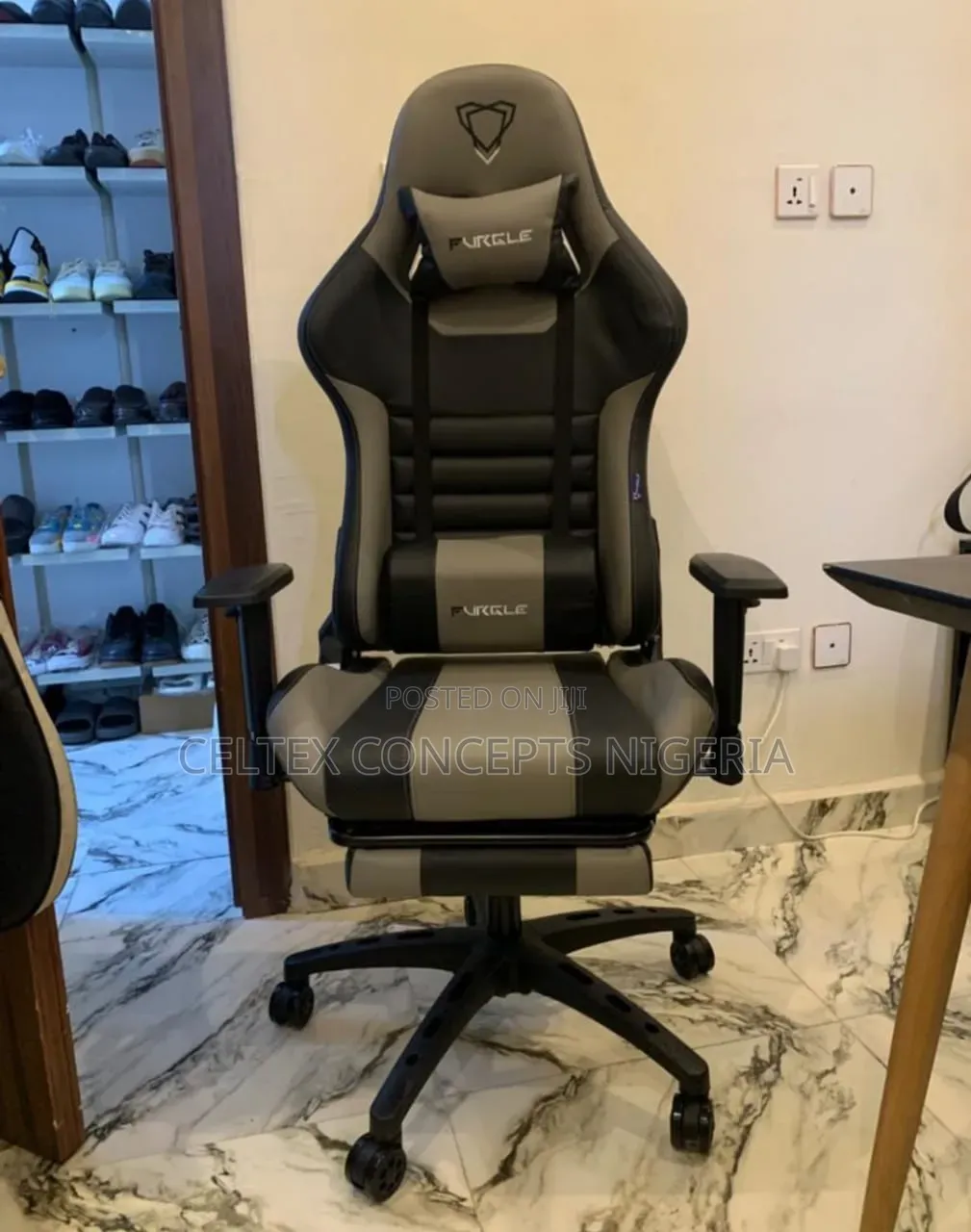 Gray and Black Gaming Chair With a Retractable Footrest