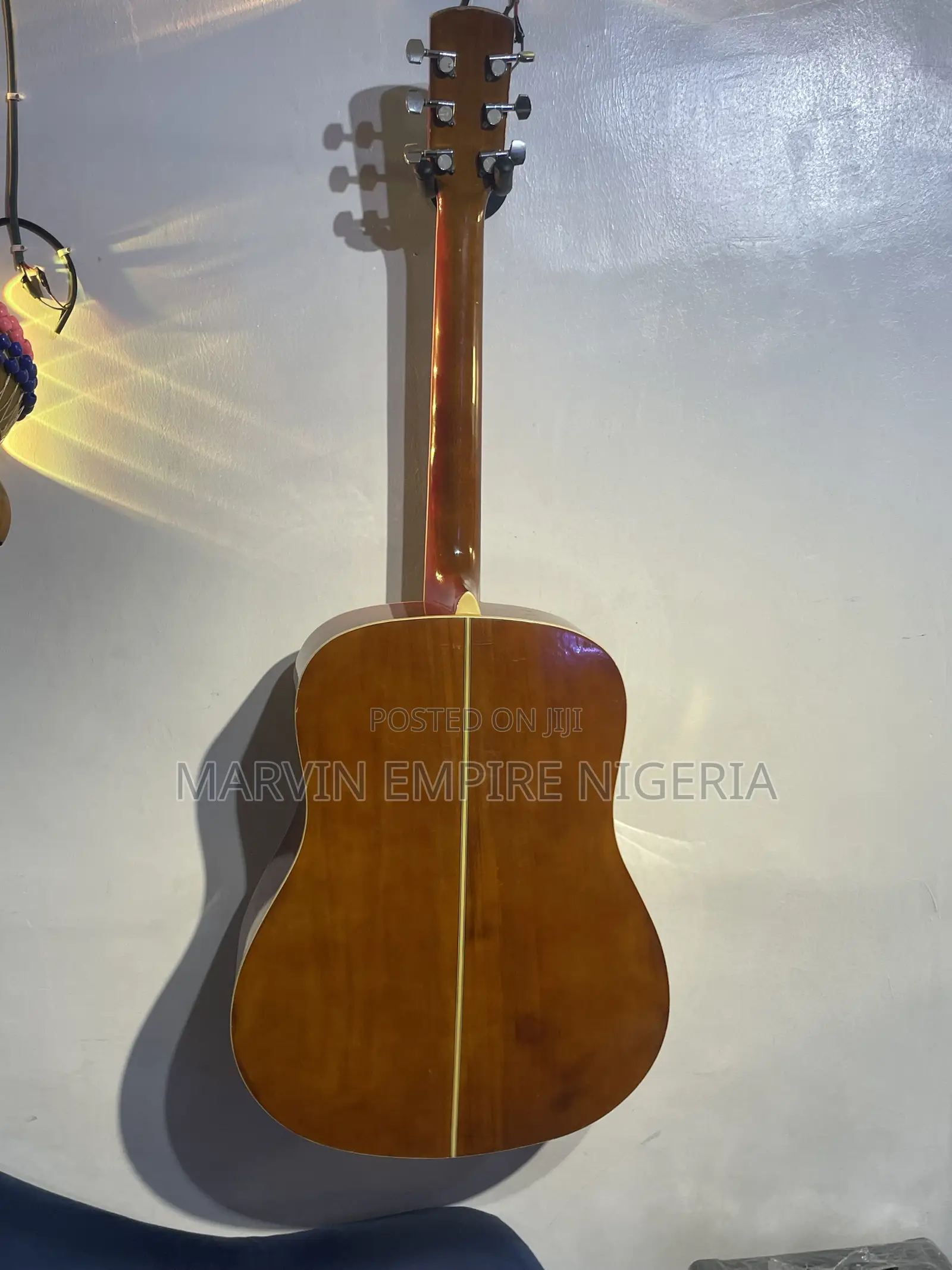 A Natural-Finish Dreadnought Acoustic Guitar With Bag