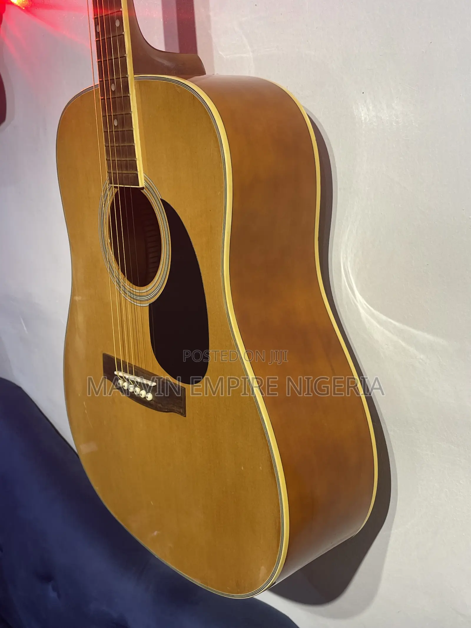 A Natural-Finish Dreadnought Acoustic Guitar With Bag