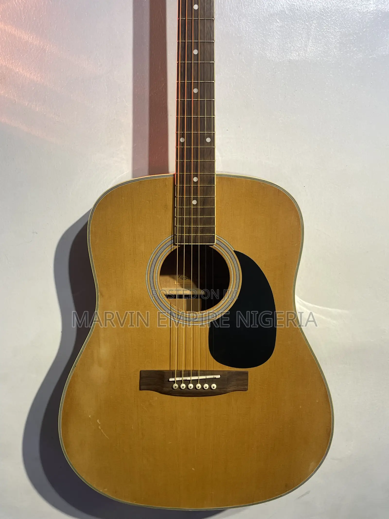 A Natural-Finish Dreadnought Acoustic Guitar With Bag