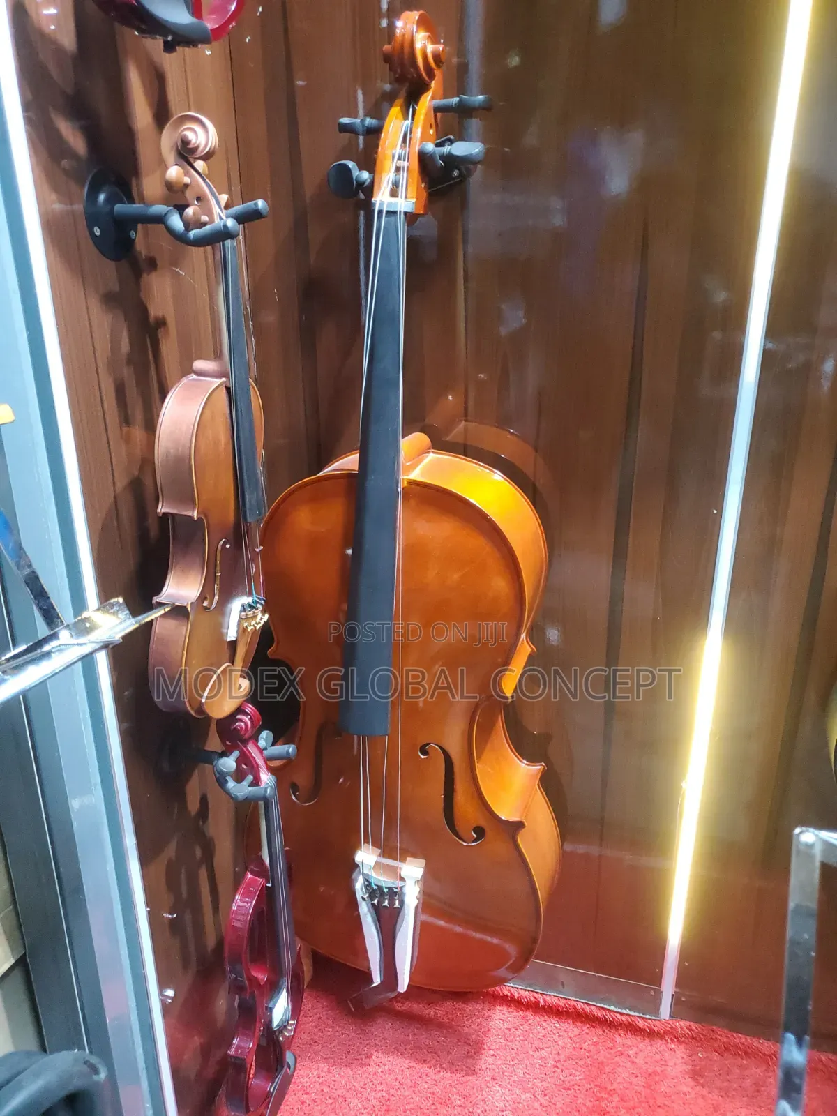 Acoustic Cello With a Glossy Amber-Orange Varnish Finish.
