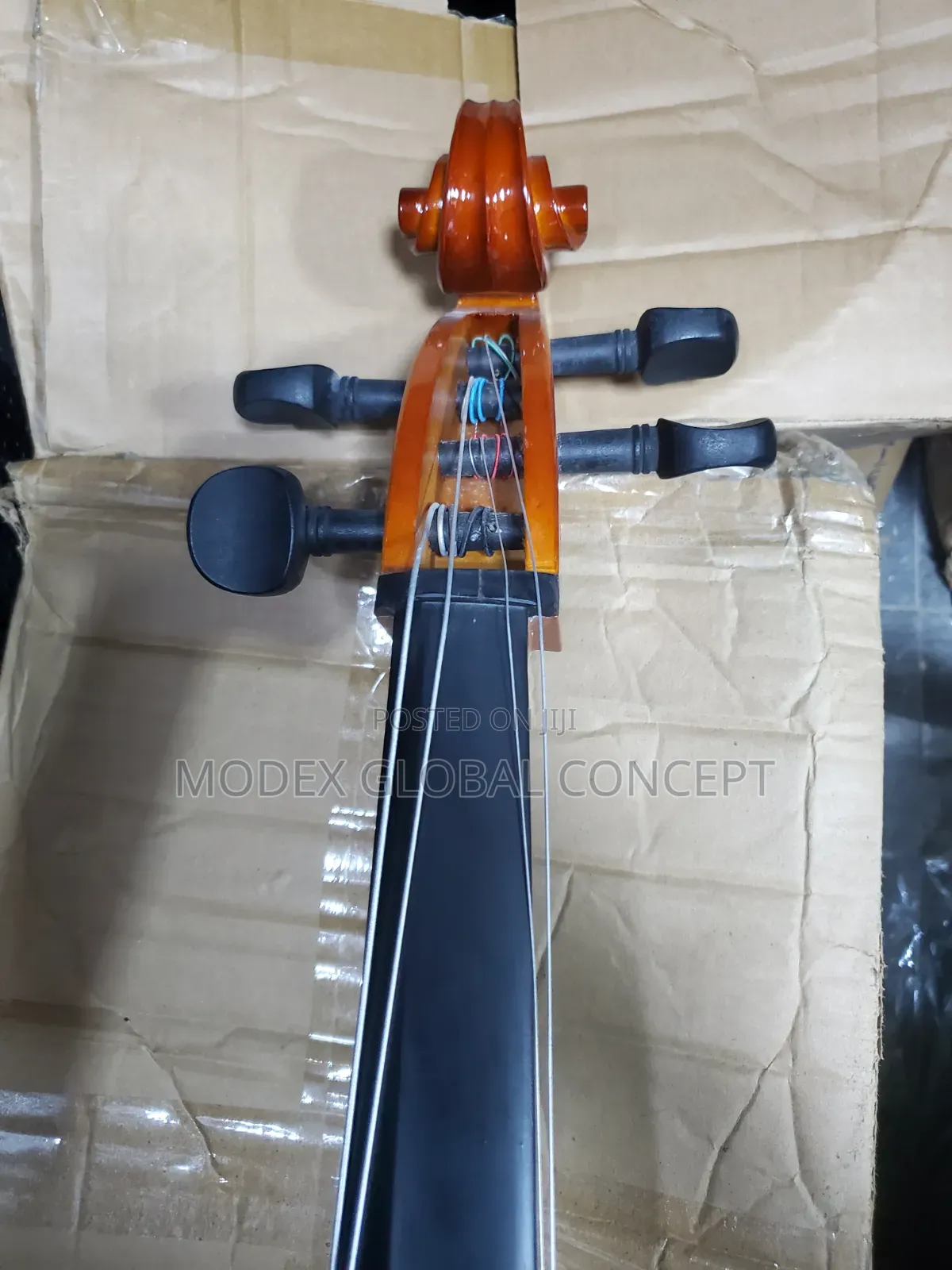 Acoustic Cello With a Glossy Amber-Orange Varnish Finish.