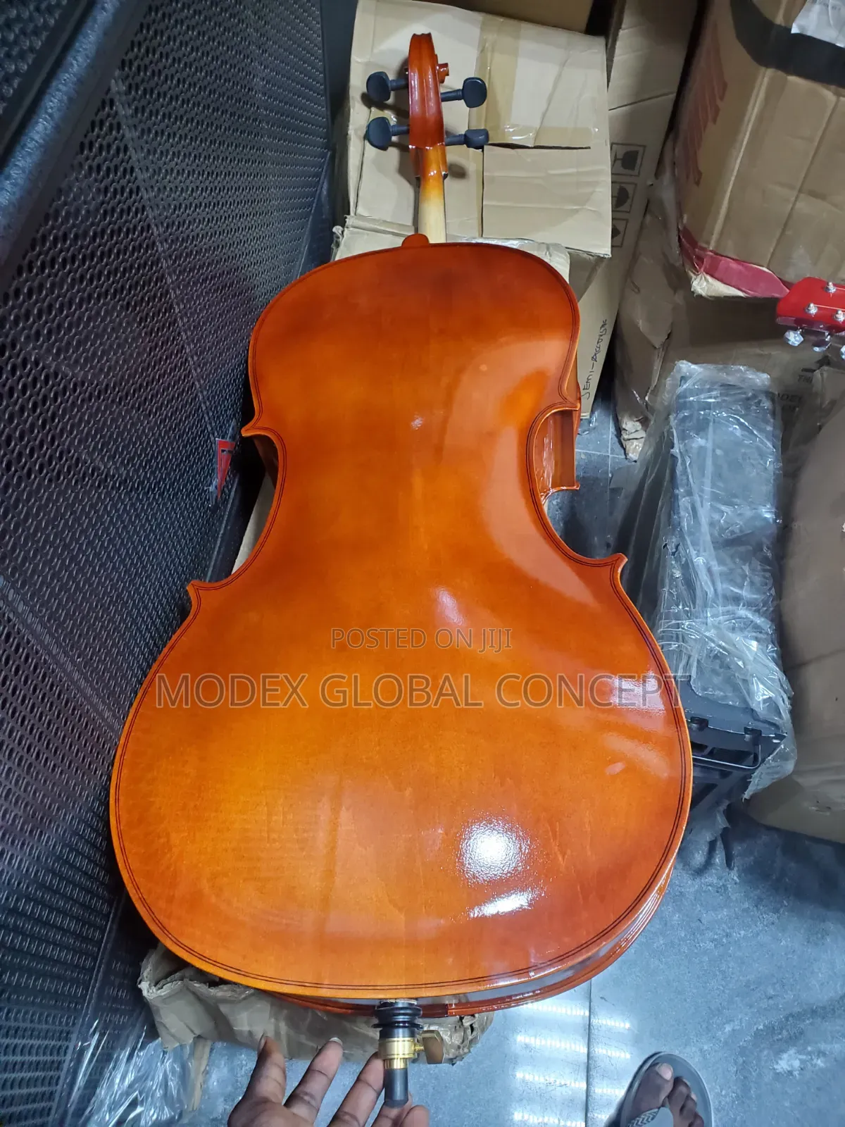 Acoustic Cello With a Glossy Amber-Orange Varnish Finish.