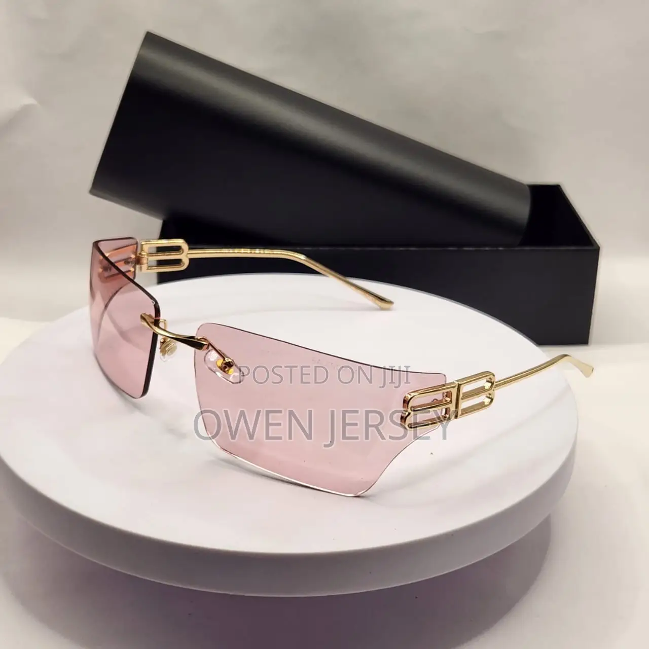 Balenciaga Rimless Shield Sunglasses – Gold-Tone With Brown Lenses.