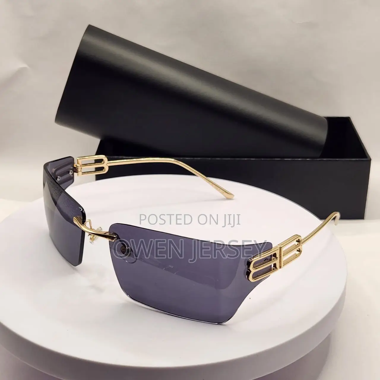 Balenciaga Rimless Shield Sunglasses – Gold-Tone With Brown Lenses.