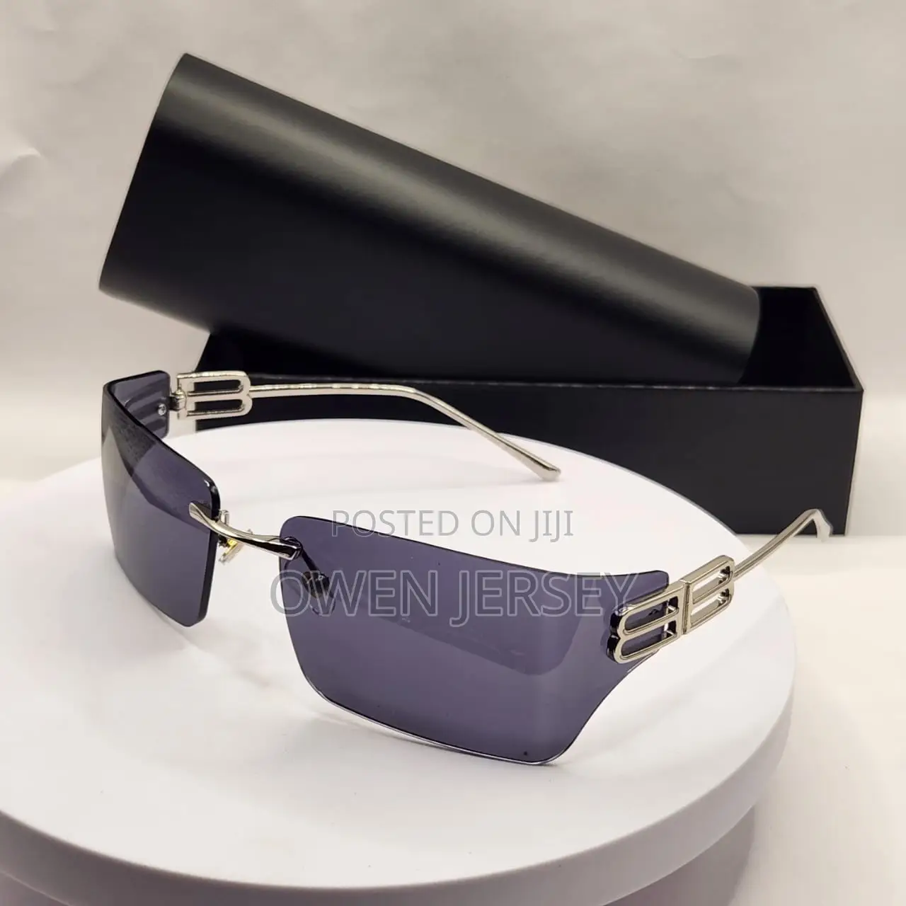 Balenciaga Rimless Shield Sunglasses – Gold-Tone With Brown Lenses.