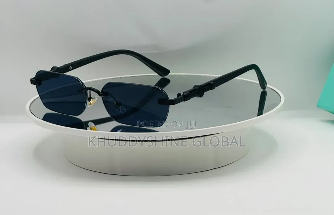 Black Rimless Rectangular Sunglasses Featuring Dark Tinted Lenses