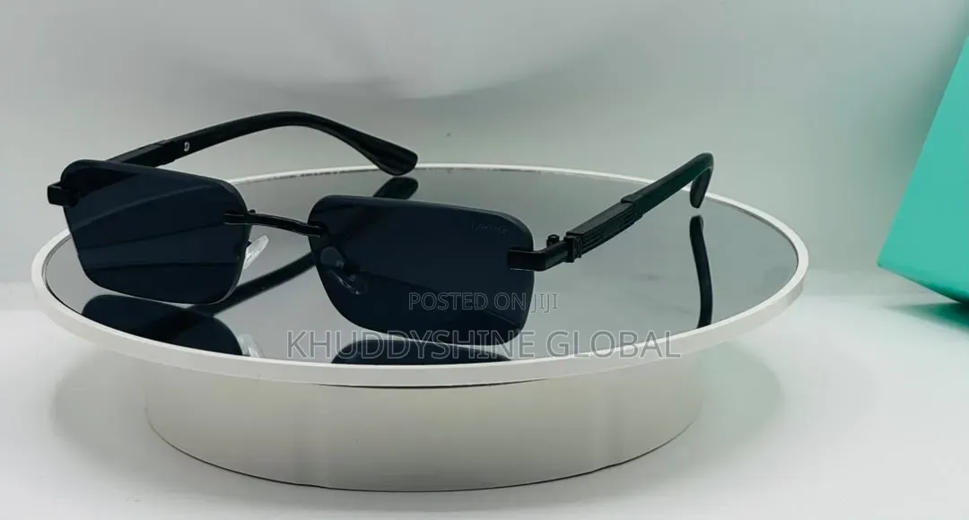 Black Rimless Rectangular Sunglasses Featuring Dark Tinted Lenses