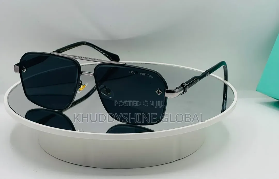 Black Rimless Rectangular Sunglasses Featuring Dark Tinted Lenses