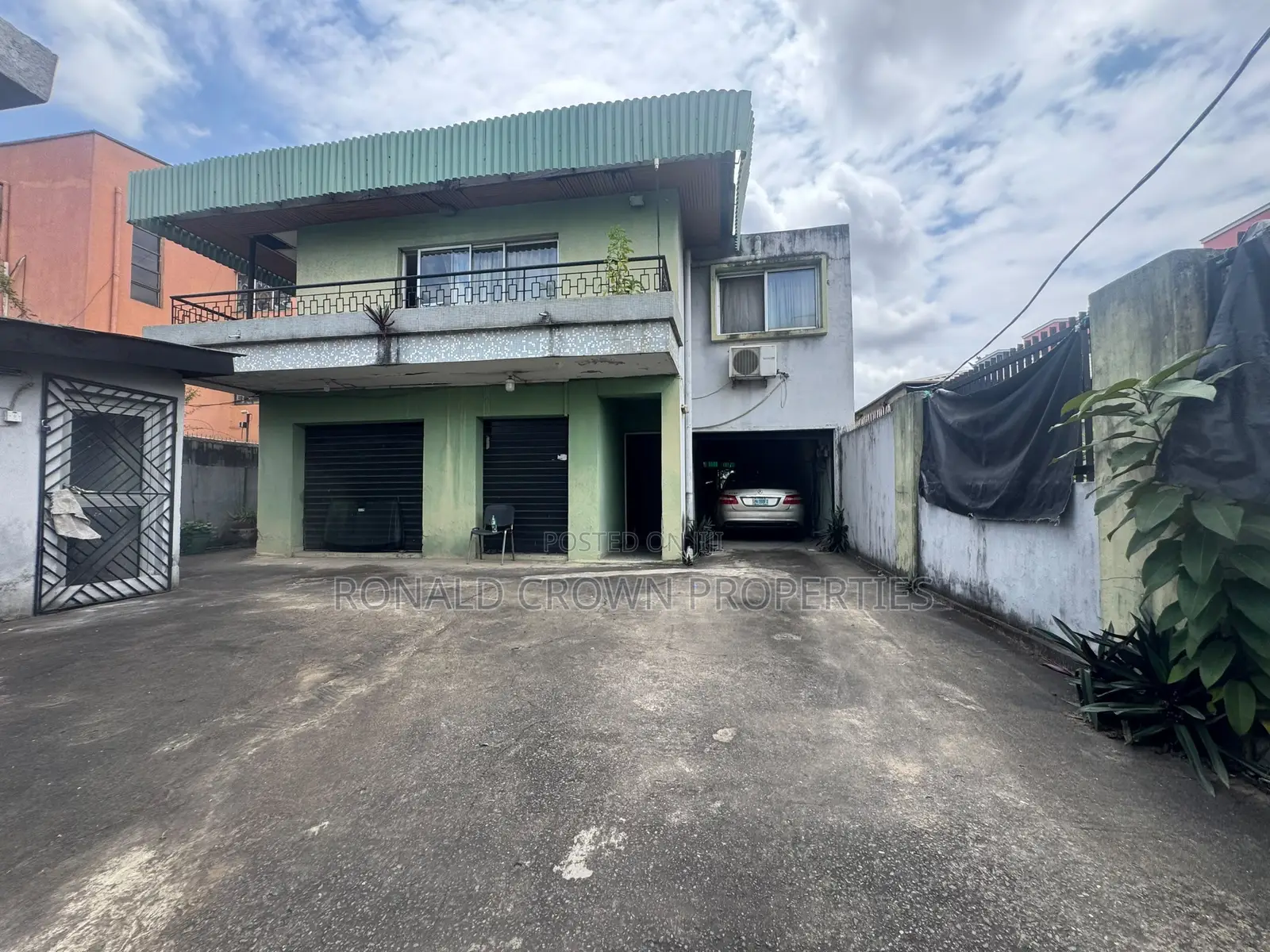 Land Measuring 557sqm With Duplex Structure on It at Ikeja
