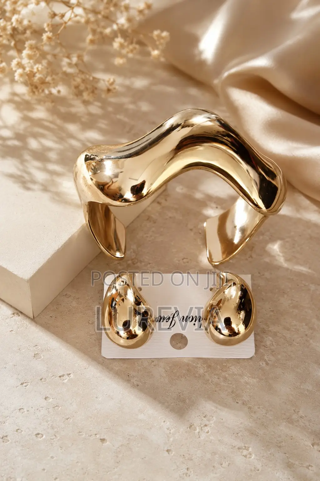 A Chunky Gold Cuff and Matching Earring