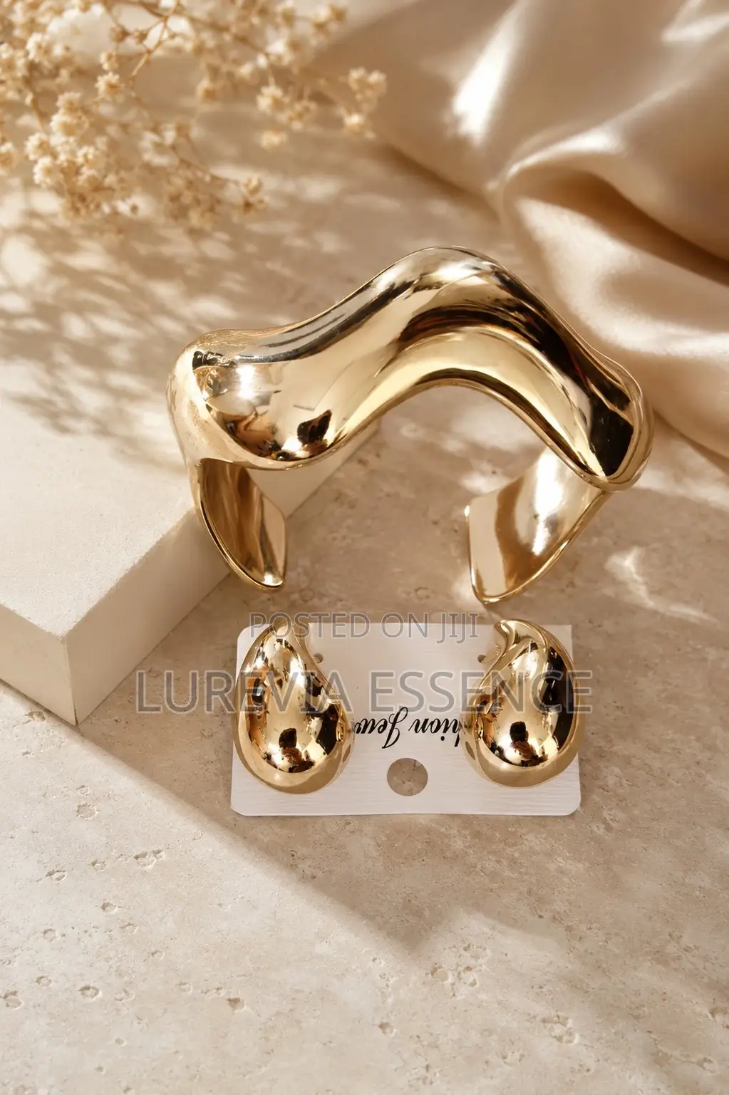 A Chunky Gold Cuff and Matching Earring