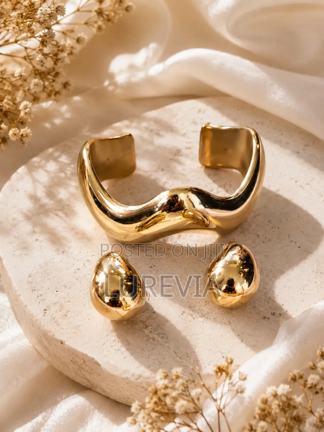 A Chunky Gold Cuff and Matching Earring