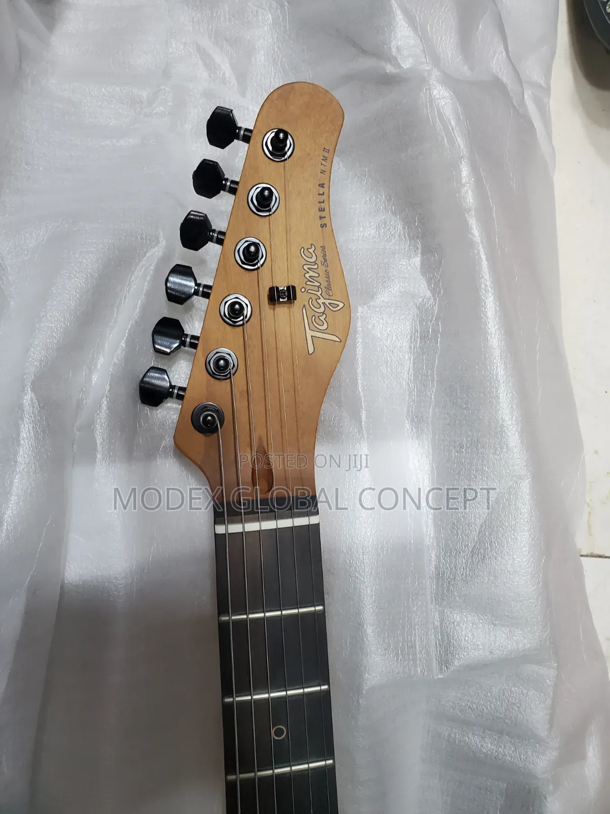 Tagima Tessy NTS Natural Satin Electric Guitar.