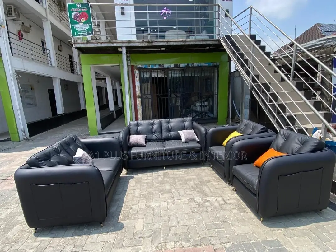 Complete Set of Black Leather Sofa With Beautiful Throw Pillows