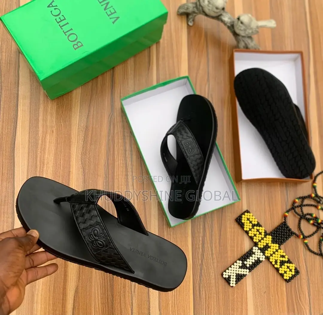 Black Leather Thong Sandals Featuring a Distinctive Woven Strap Design