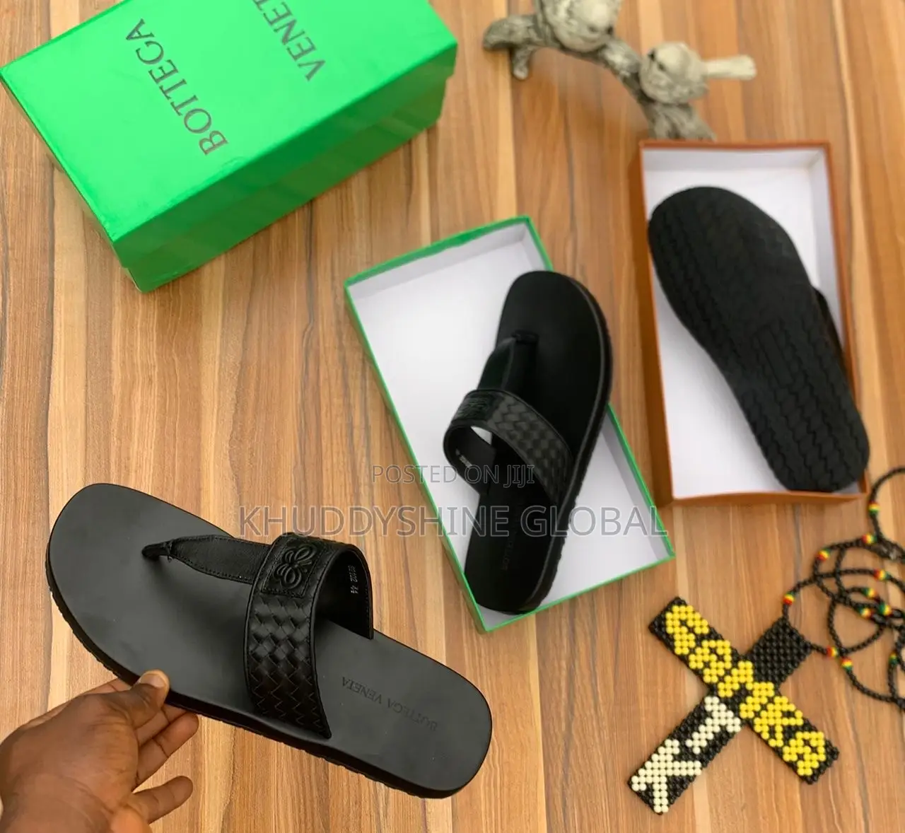 Black Leather Thong Sandals Featuring a Distinctive Woven Strap Design