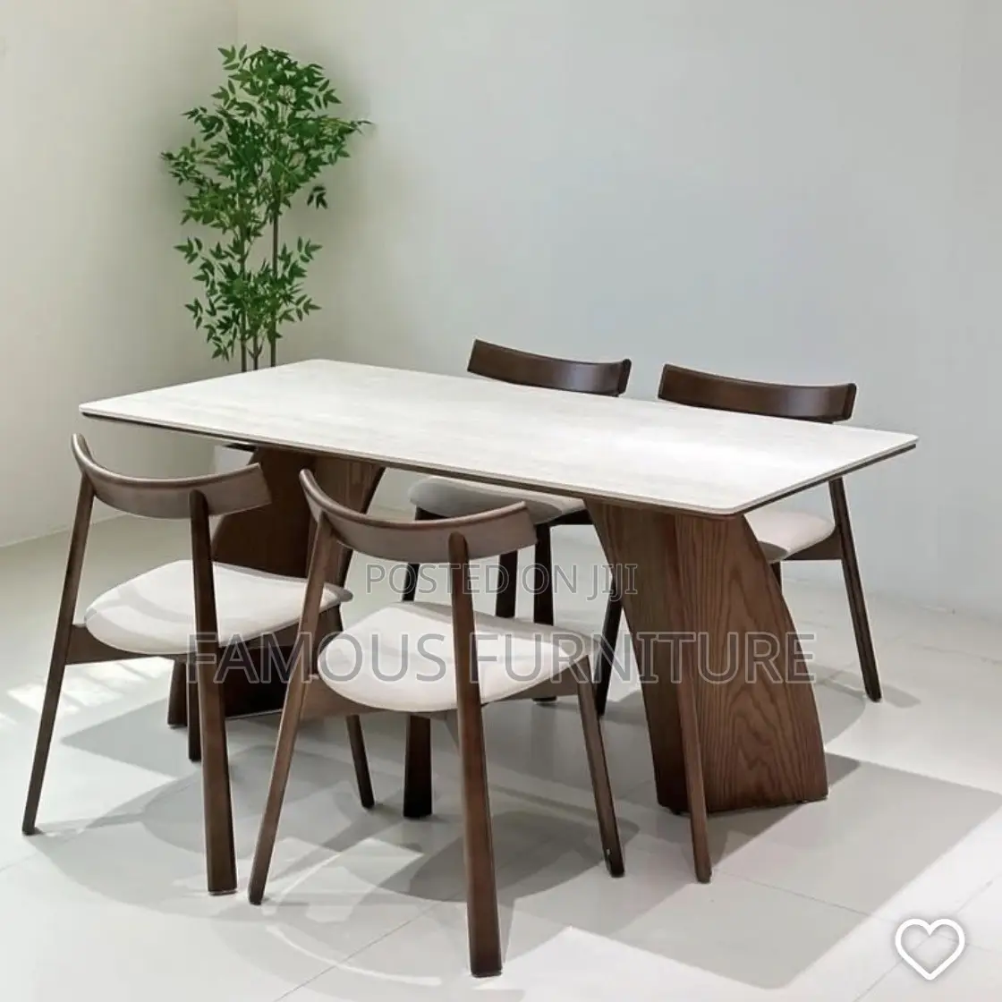 This Is a Modern 6-Seater Dining Set Featuring a Light-Colored Marble