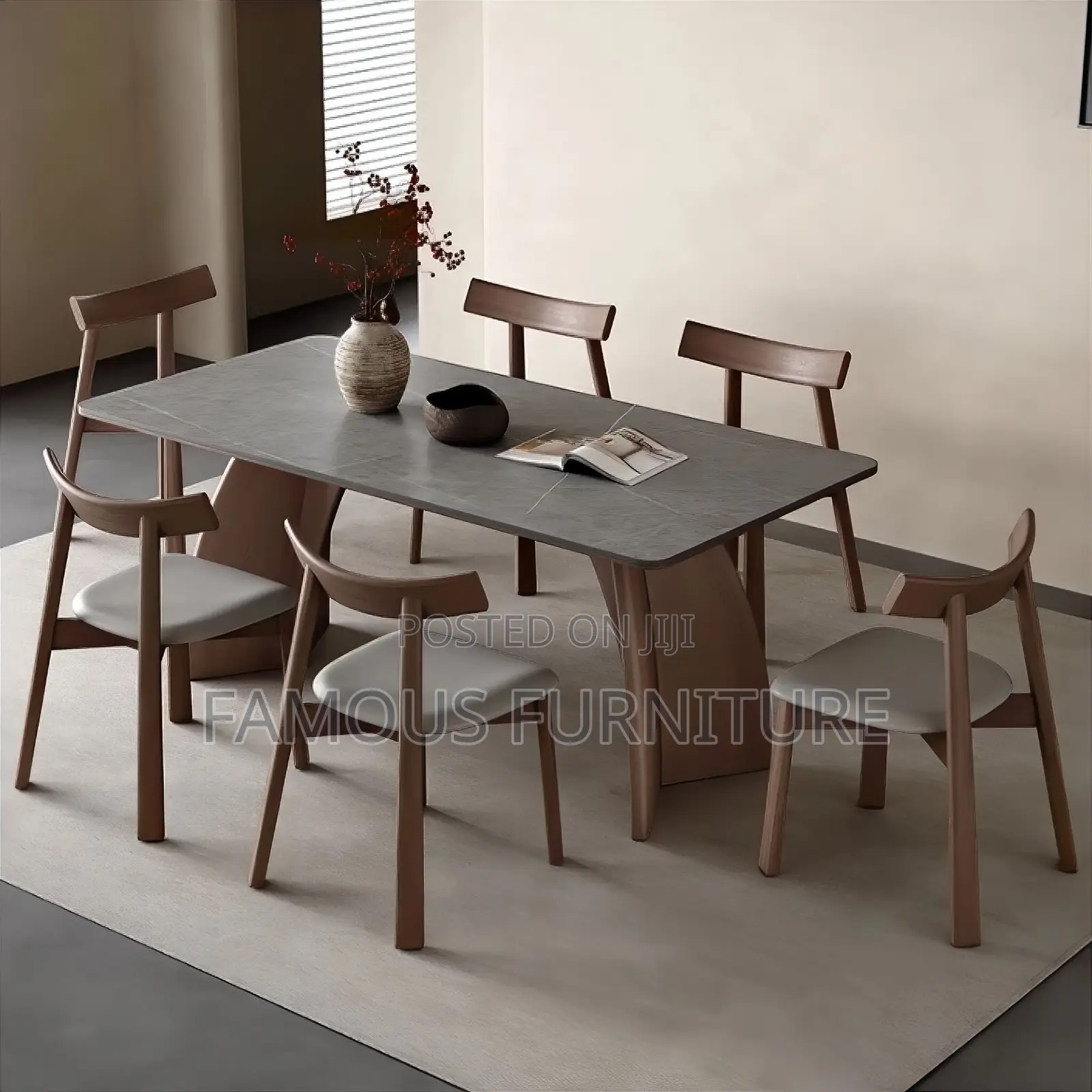 This Is a Modern 6-Seater Dining Set Featuring a Light-Colored Marble