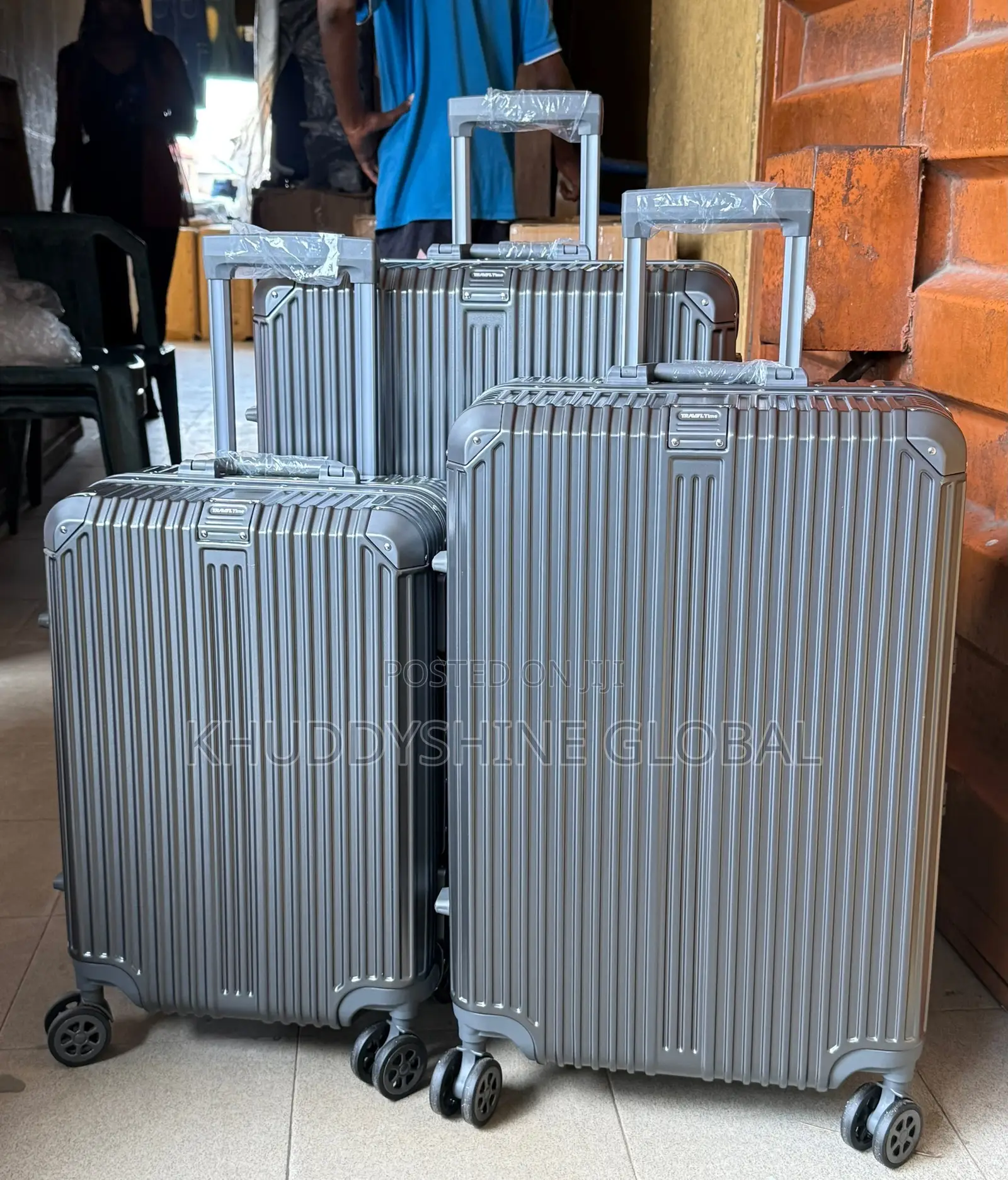 Set of Grey Vertical-Striped Aluminum-Frame Trolley Suitcases With 360