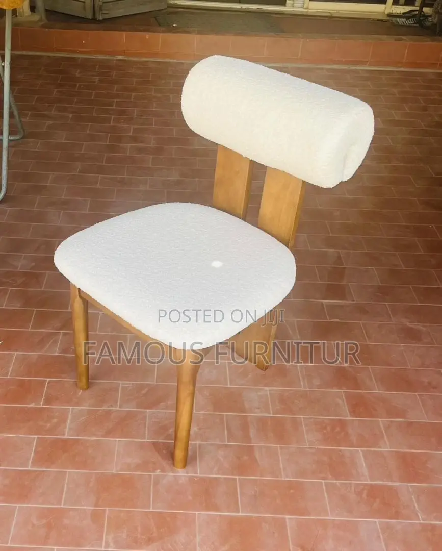 This Contemporary Dining Chair Features a Striking Dark Wood Frame Pai
