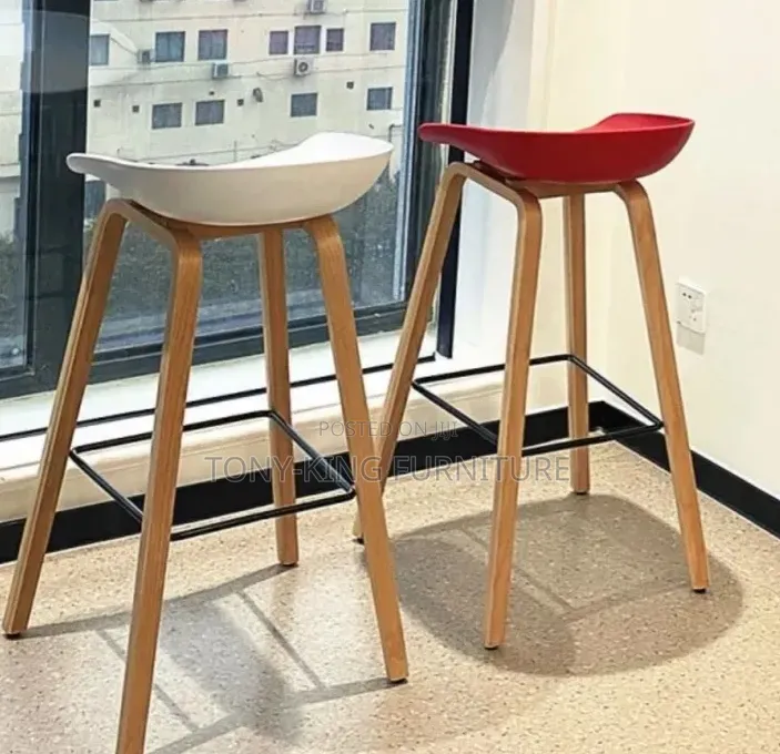 Minimalist White Bar Stool With Metal Legs and a Metal Footrest Ring