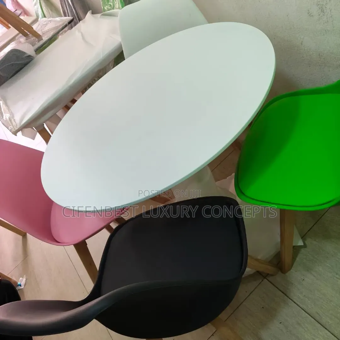 Stylish restaurandDinning Table With Four Coloured Chairs