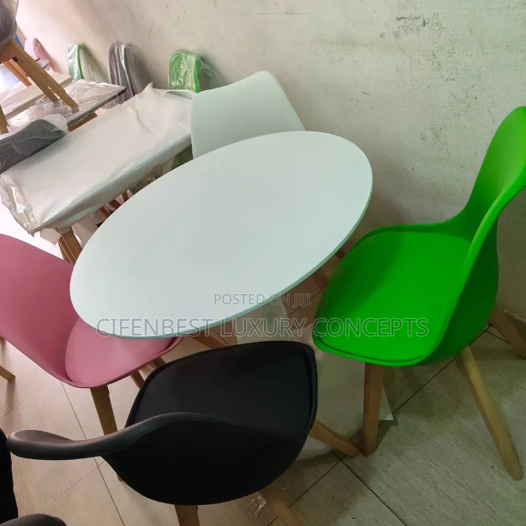 Stylish restaurandDinning Table With Four Coloured Chairs