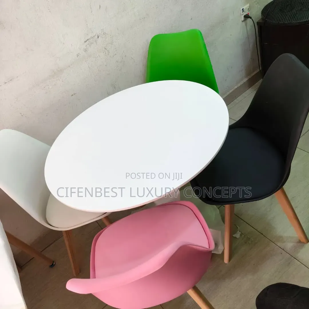 Stylish restaurandDinning Table With Four Coloured Chairs