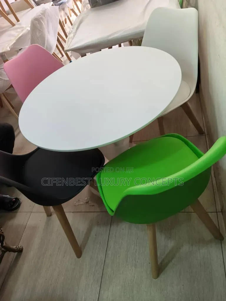Stylish restaurandDinning Table With Four Coloured Chairs