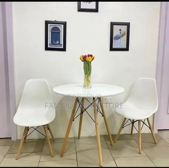 Mid-Century Modern Round Dining Set Featuring a Smooth White Table