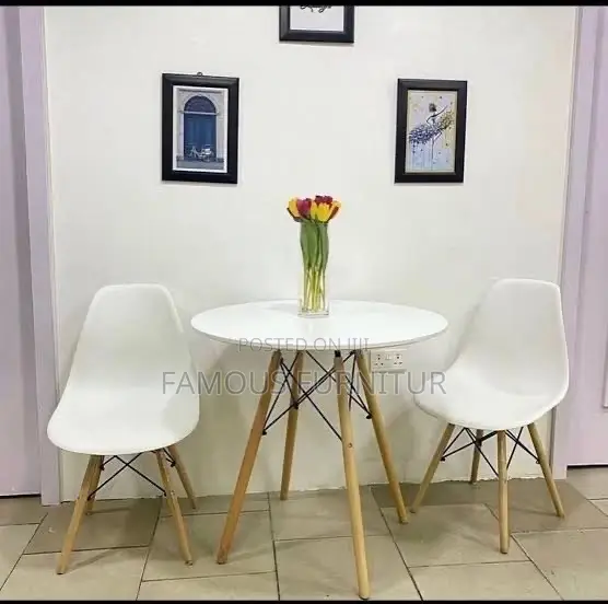 Mid-Century Modern Round Dining Set Featuring a Smooth White Table