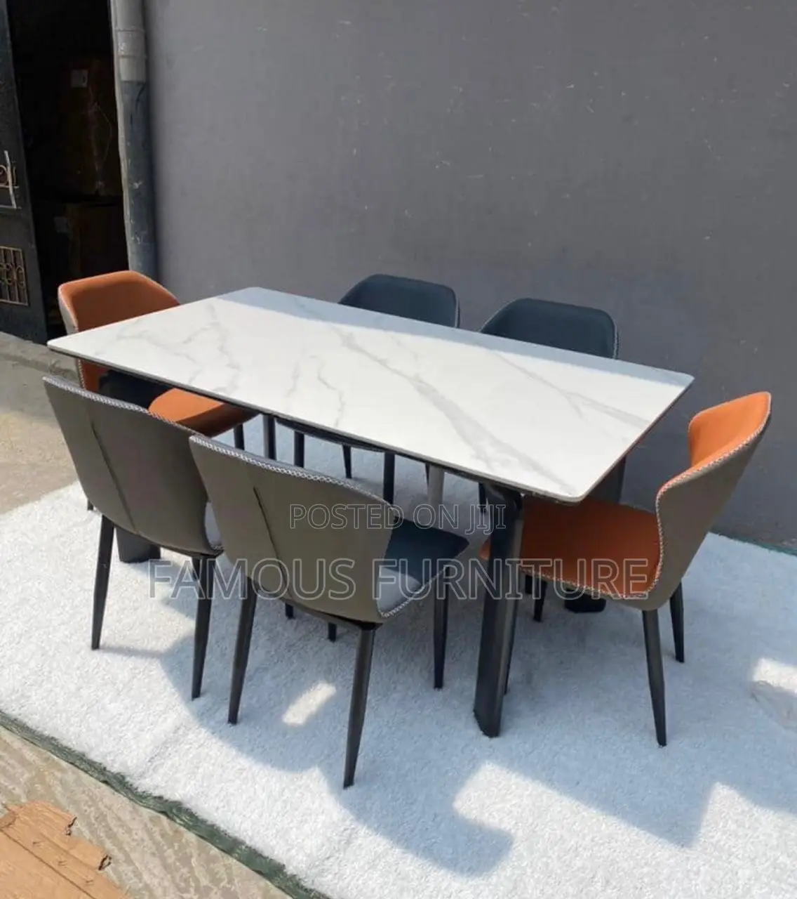 This Appears to Be a Modern 6-Seater Dining Set Featuring a Dark