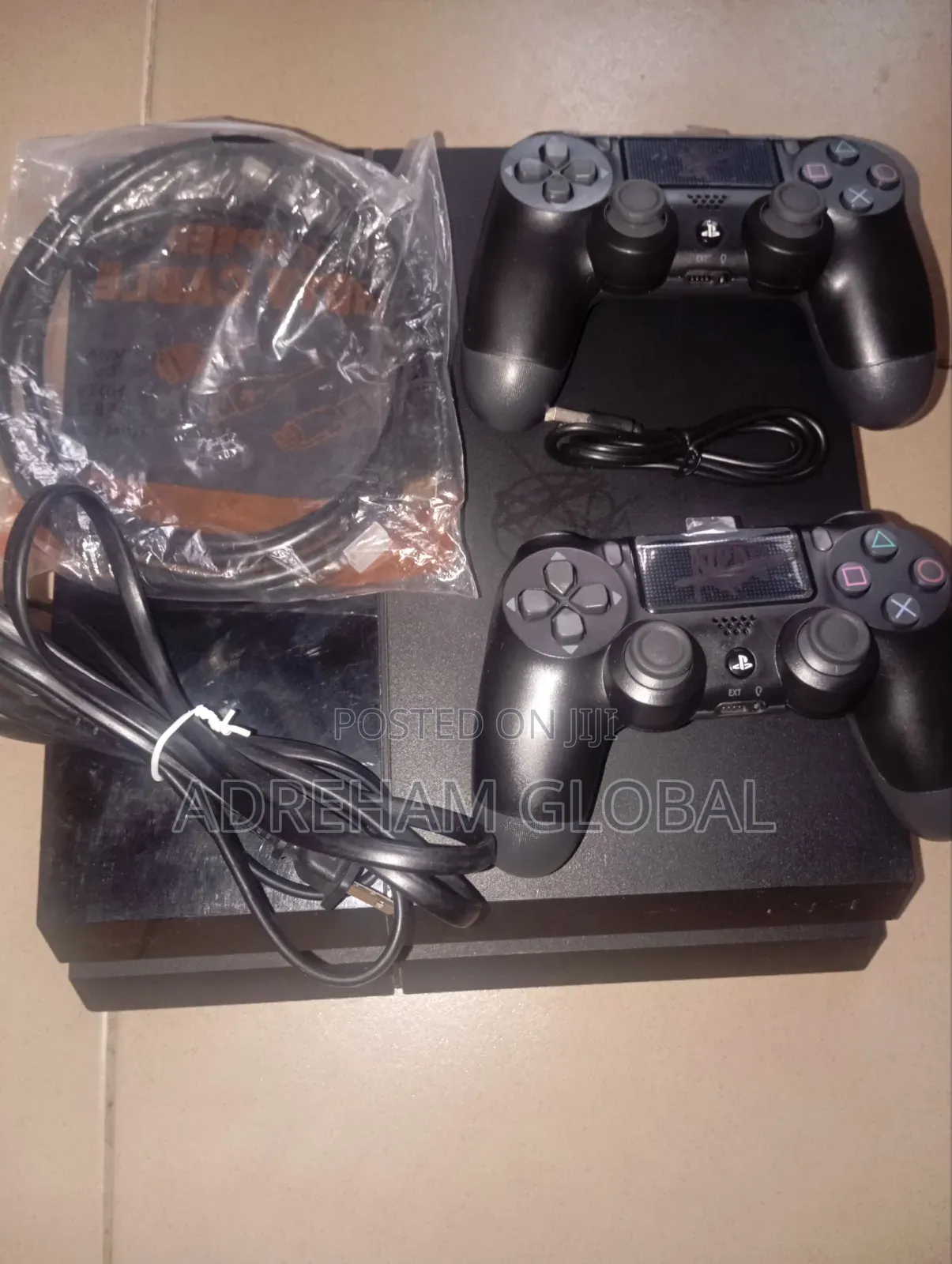 UK Used Sony PS4 With Games Installed and 2 Pads With Power USB Cord