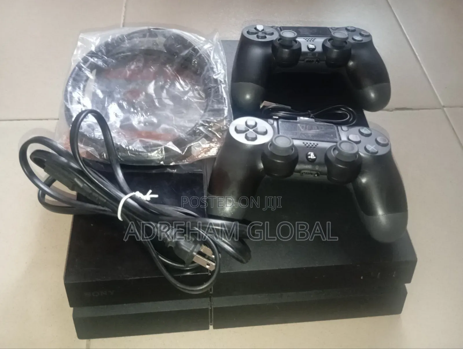 UK Used Sony PS4 With Games Installed and 2 Pads With Power USB Cord