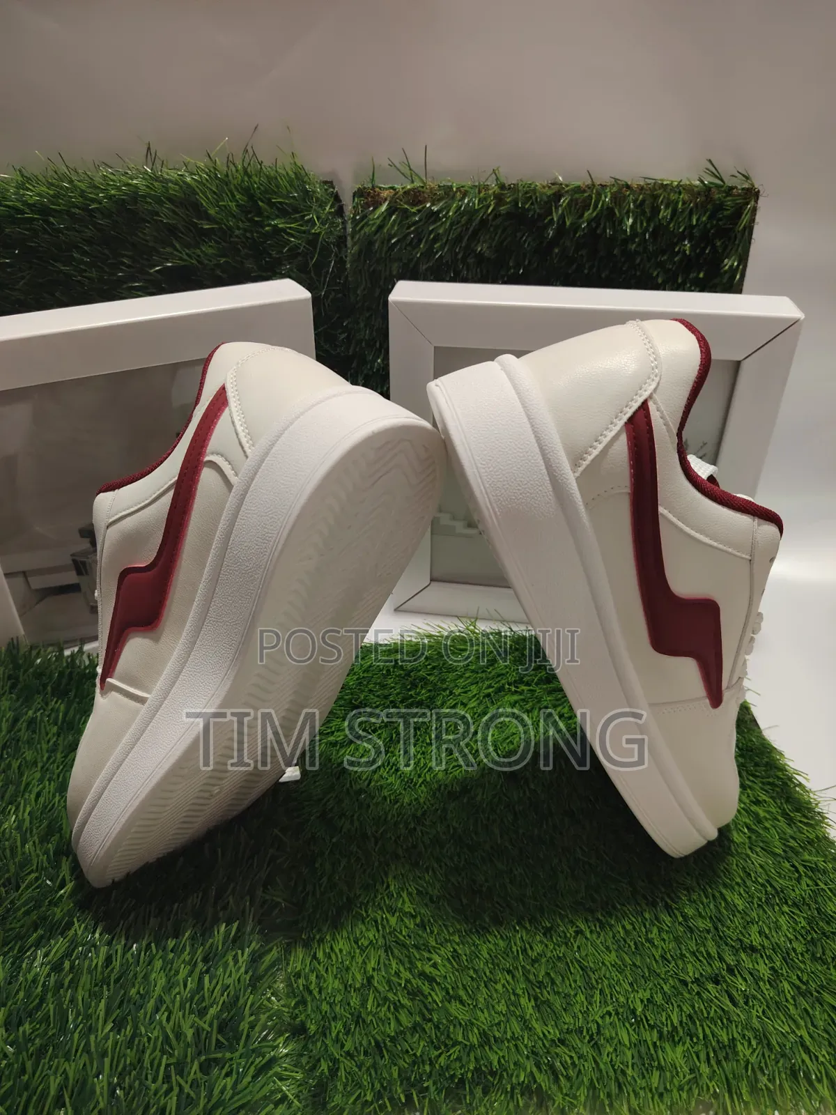 Timeless White Sneakers With Striking Red Accents on a Sleek Design
