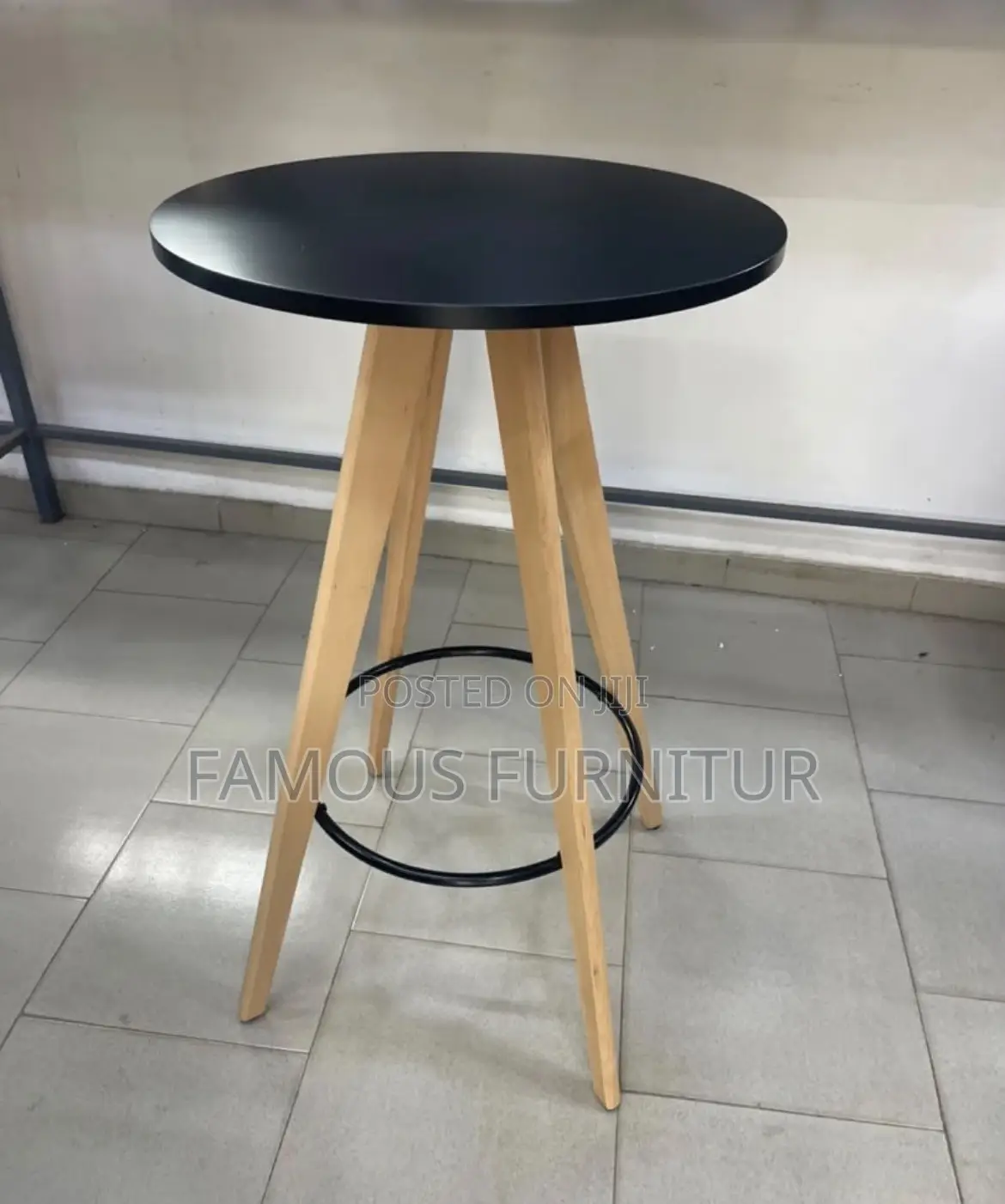 Modern Bar Set Featuring a Round Black-Topped Table Paired Barstools