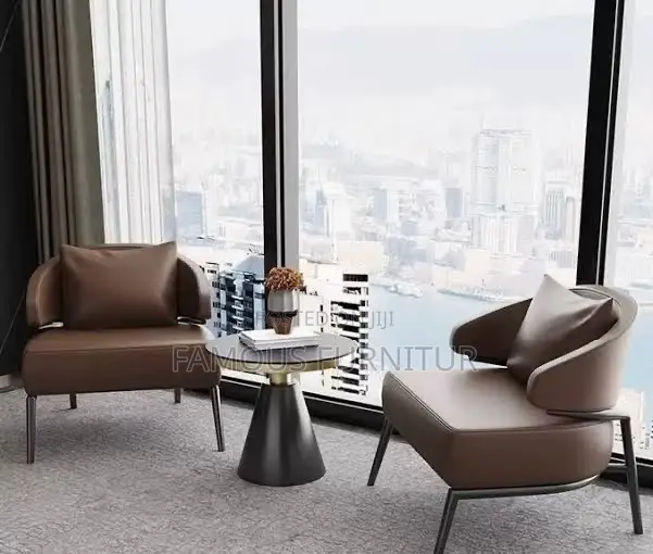 Tan Leather Accent Chair With Curved Armrests and Black Metal Legs,
