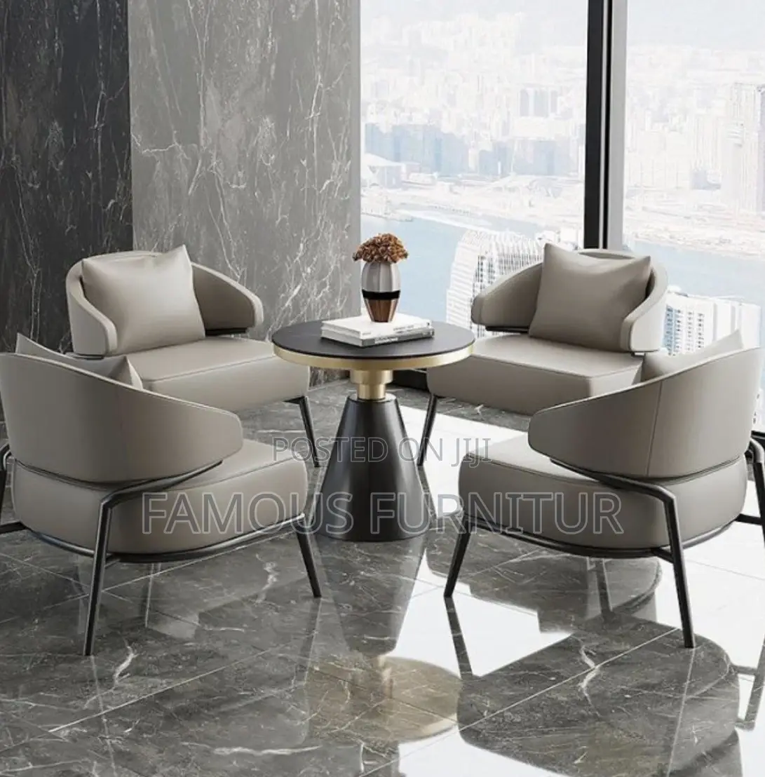 Tan Leather Accent Chair With Curved Armrests and Black Metal Legs,