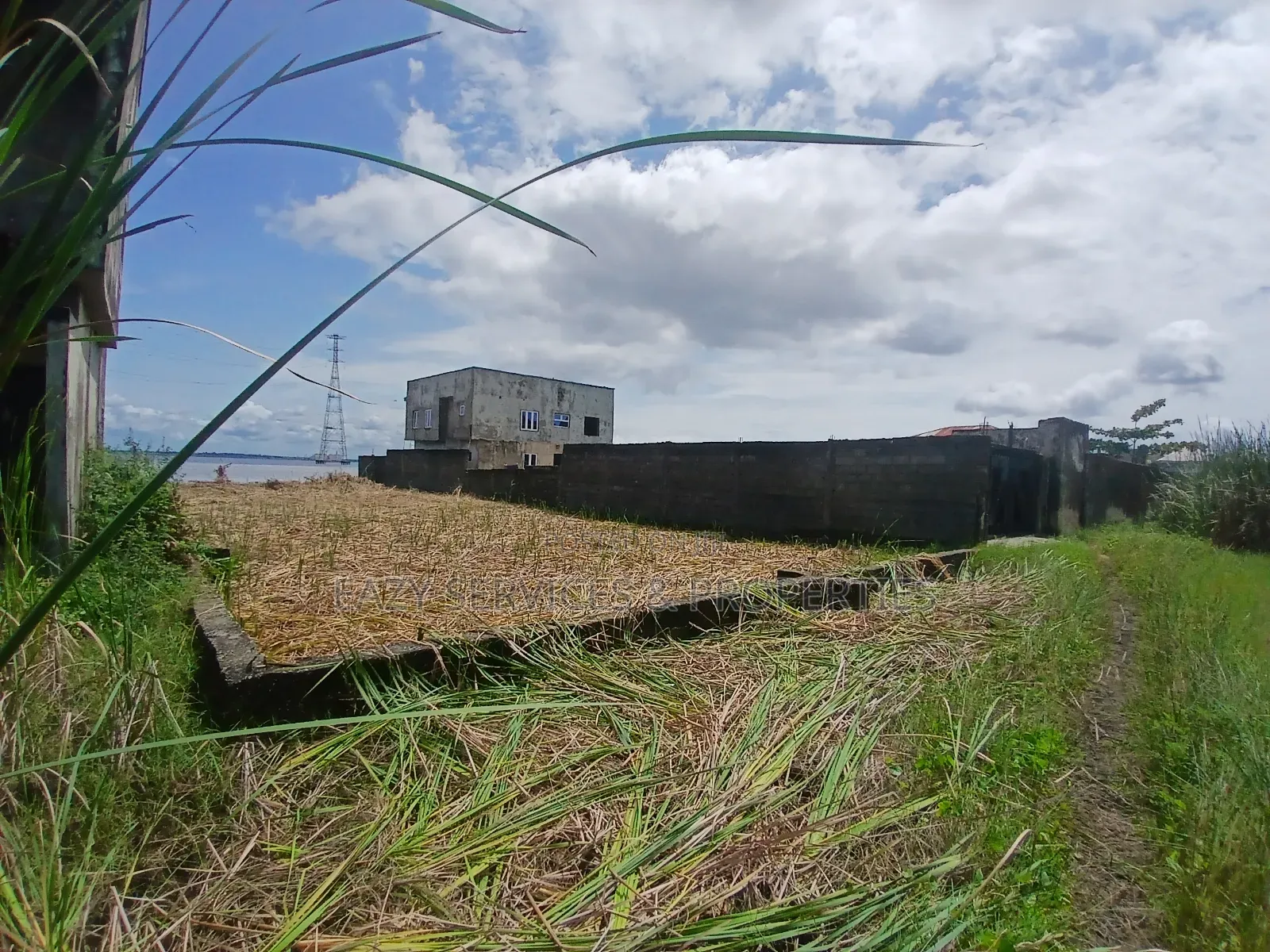 Waterfront Land Measuring 2,398sqm (4plots) in Badore Road, Ajah