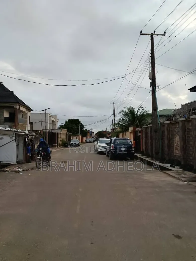 Half Plot of Land With a Demolishable Structure, on a Tared Street