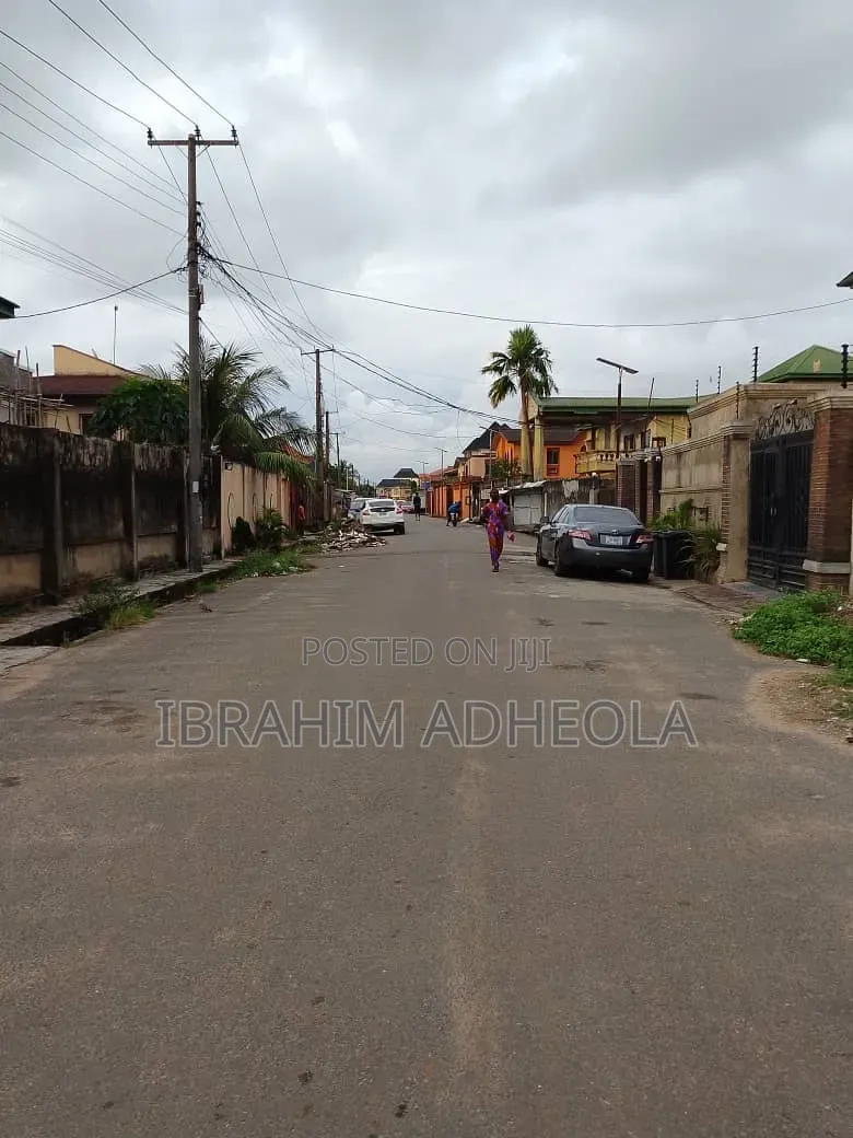 Half Plot of Land With a Demolishable Structure, on a Tared Street