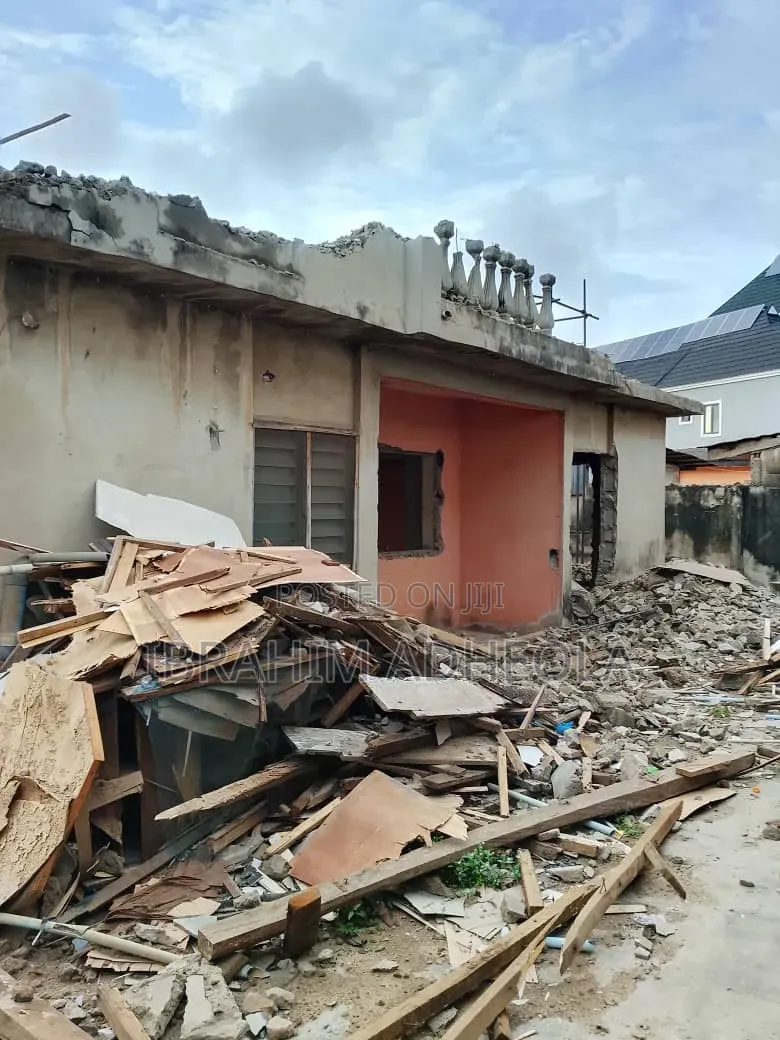 Half Plot of Land With a Demolishable Structure, on a Tared Street